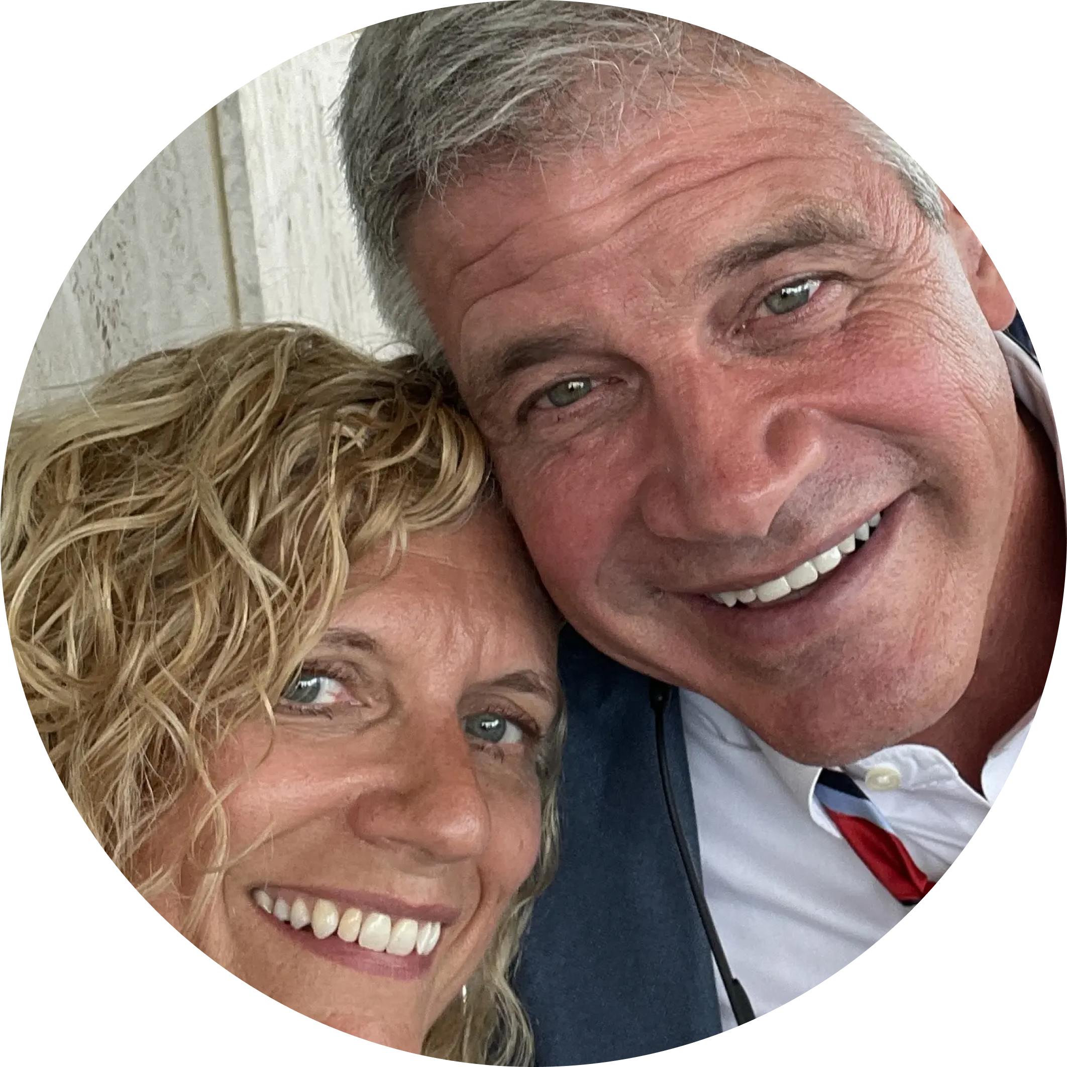Smiling couple posing for a selfie.